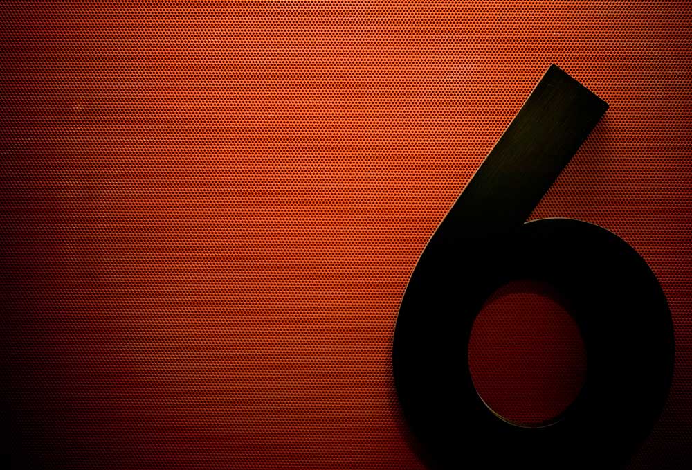 a number six against a red background
