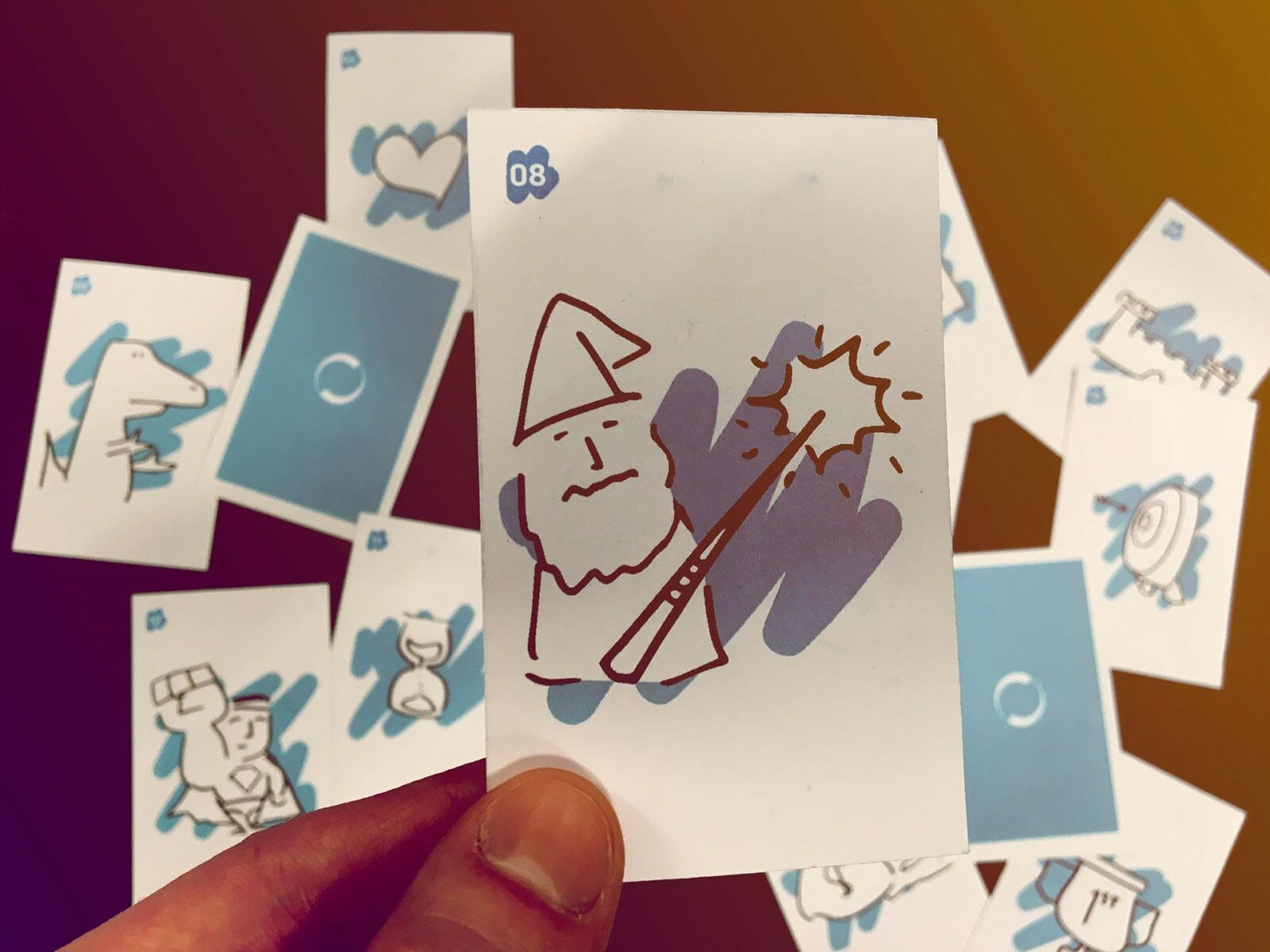 A card with an illustration of a wizard holding a wand